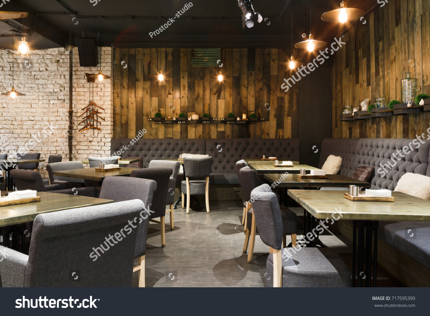 Cozy wooden interior of restaurant, copy space. Comfortable modern dining place, contemporary design background #717595390