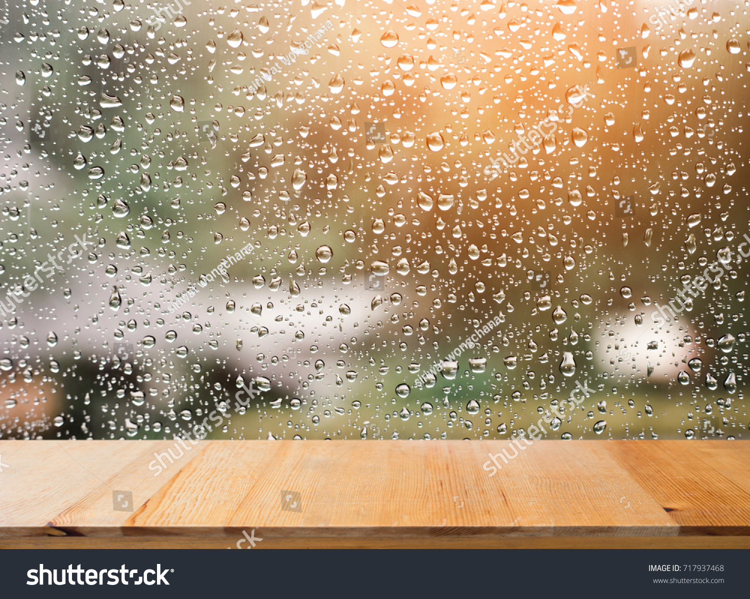 Wood table top on rain drops on clear window - can be used for display or montage your products #717937468