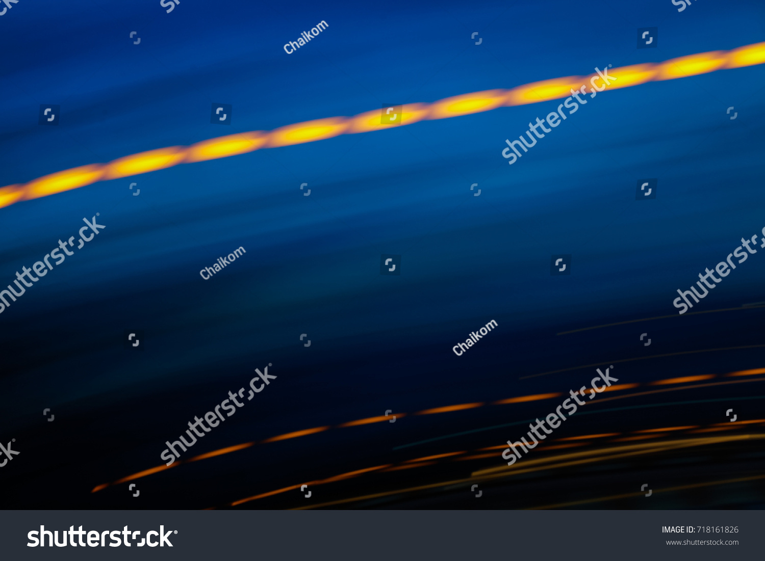 Abstract motion blur of multicolor night light on a black background. #718161826