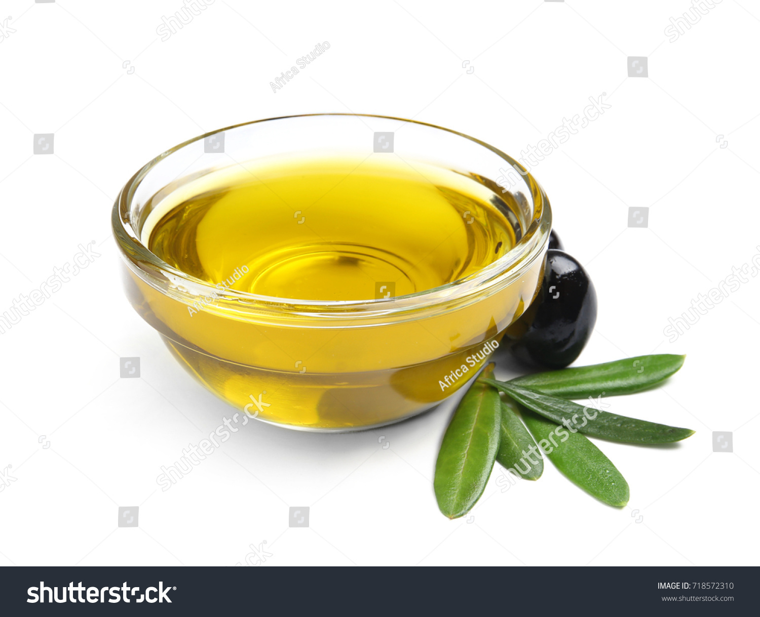 Bowl with olive oil isolated on white #718572310