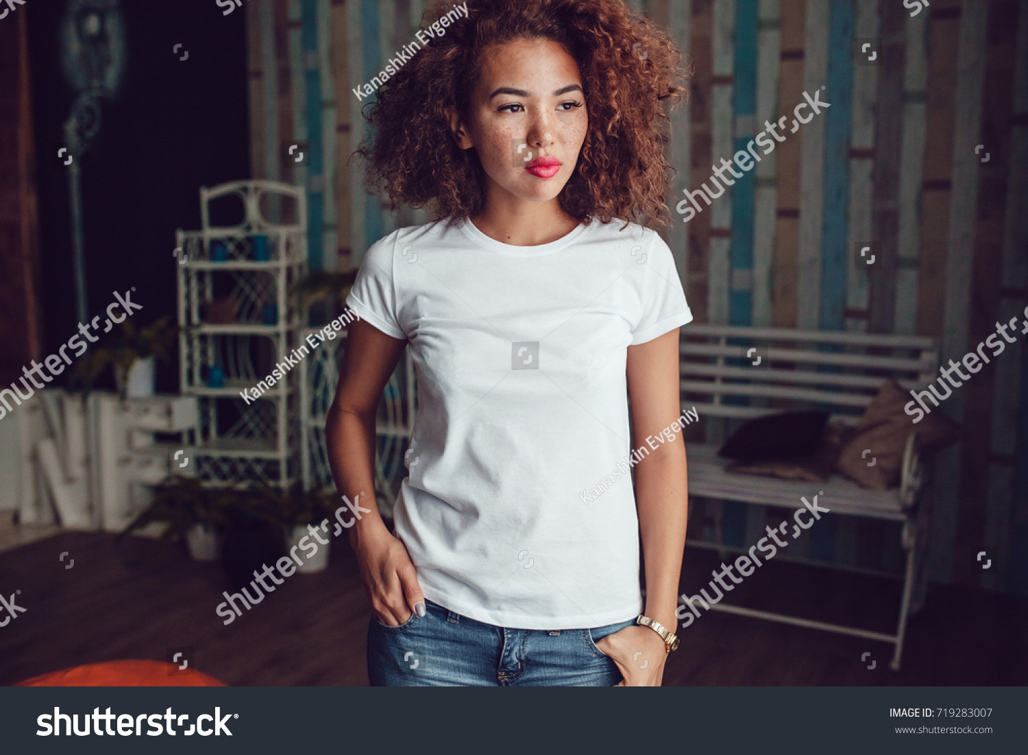 Curly haired girl with freckles in blank white t-shirt. Mock up. #719283007