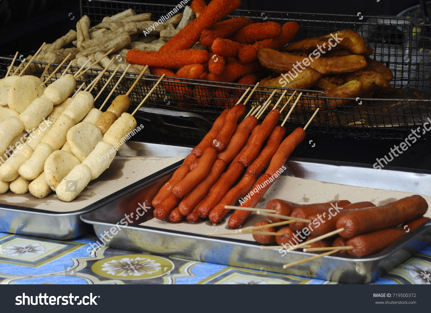 Sausages and some processed foods are pecked with skewers and served. #719500372