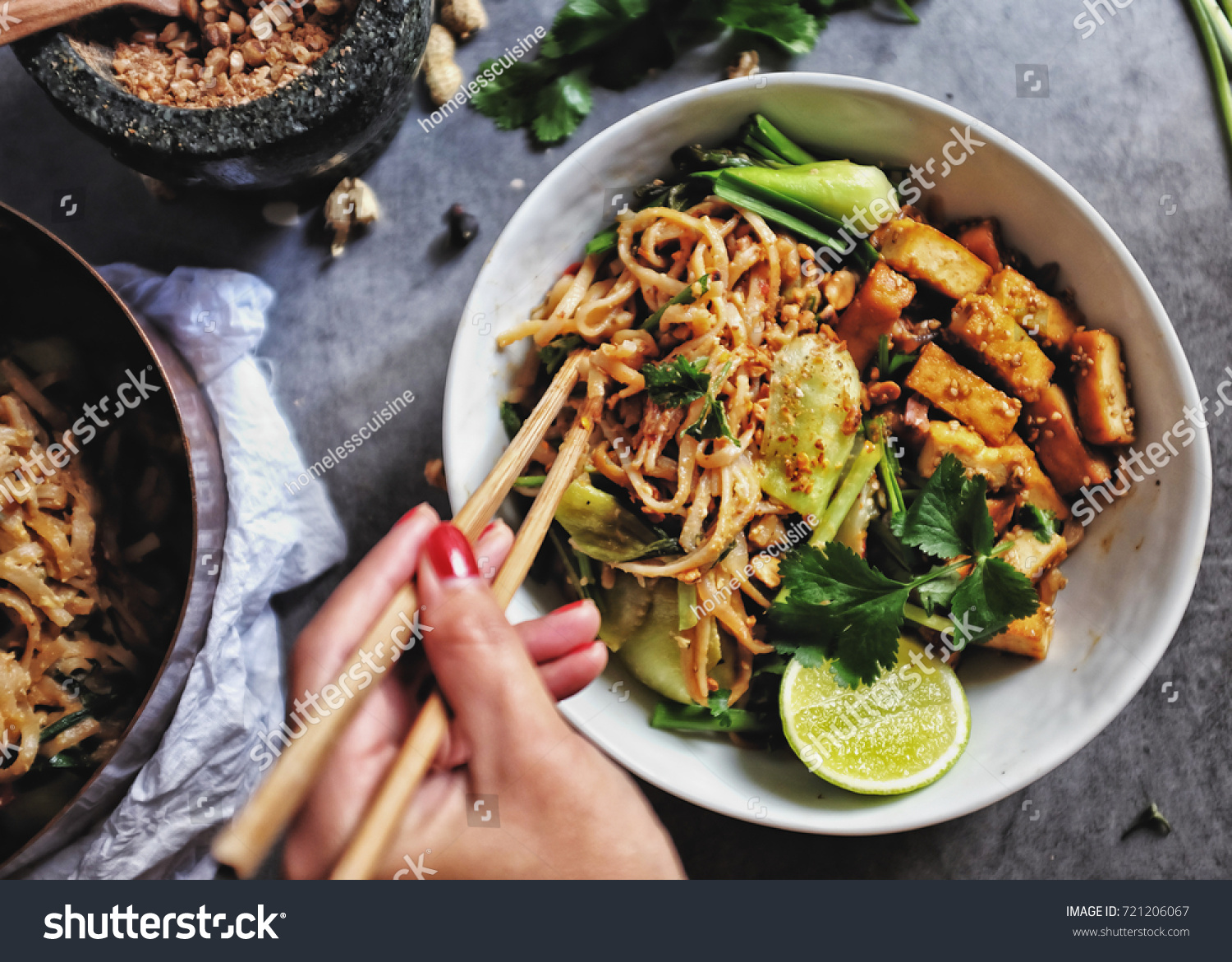  Udon with Padthai sauce, Healthy Vegetarian/vegan menu; Padthai noodle with smoke tofu and mixed vegetable - chinese baby Bok Choy , garlic chive, shallot and crushed peanut topping. chopstick hold. #721206067