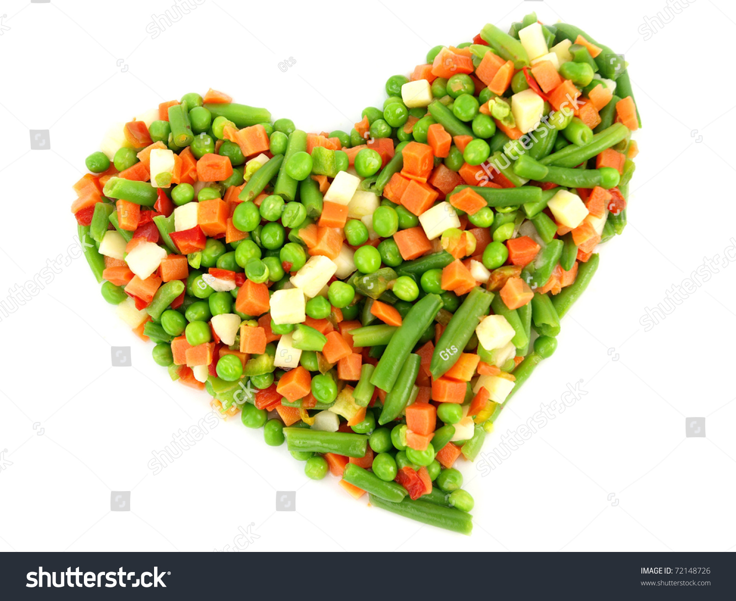 Heart of a frozen mixed vegetables isolated on white background #72148726