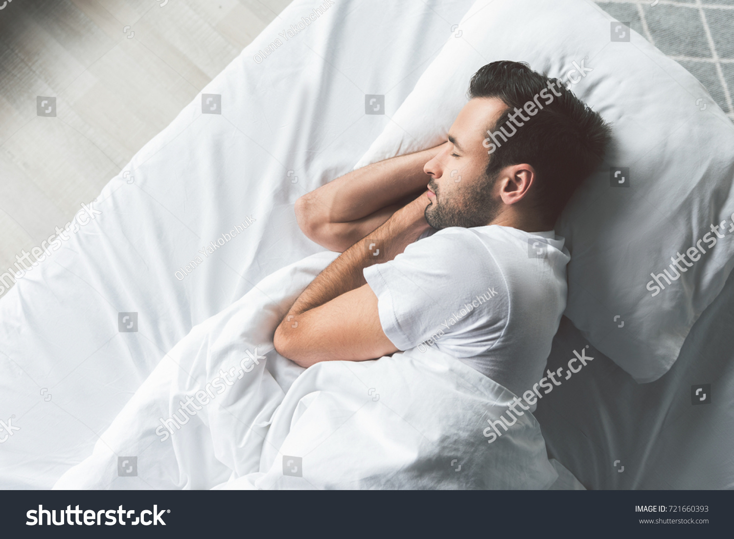 Cute young man sleeping on bed #721660393
