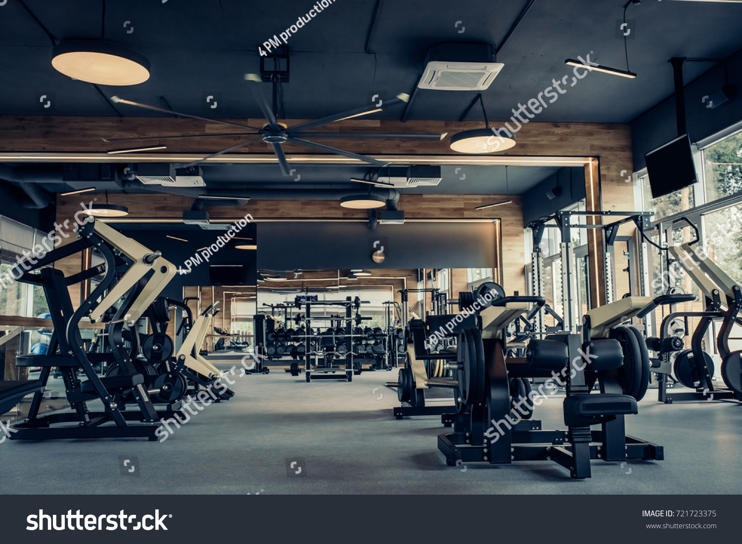 Modern light gym. Sports equipment in gym. Barbells of different weight on rack. #721723375