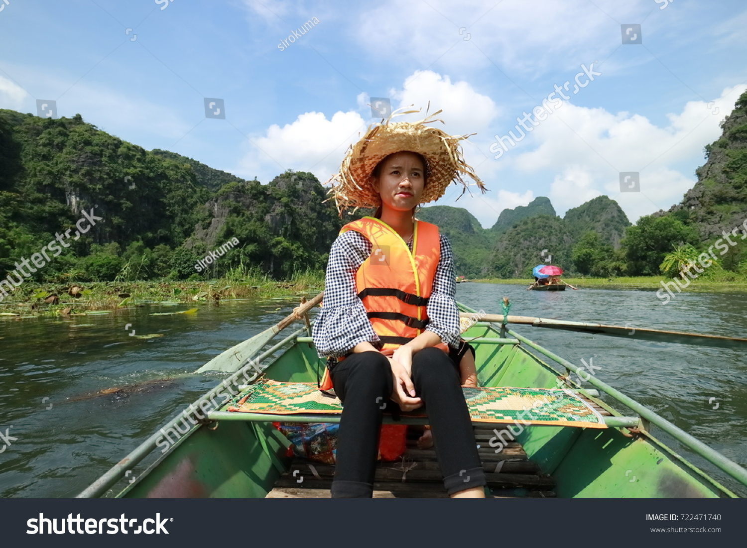 Young girl traveling to Tam Coc in Ninh Binh, Vietnam #722471740