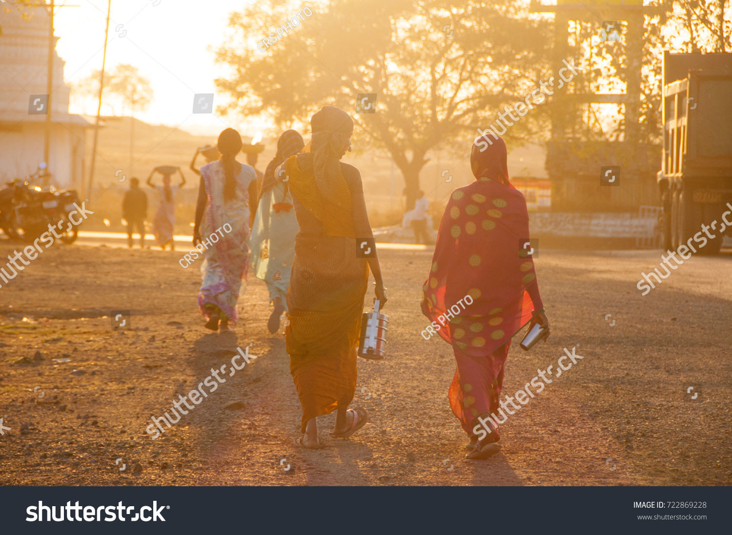 BHIWAPUR, NAGPUR, MAHARASHTRA, INDIA 13 FEBRUARY 2016 : Unidentified rural woman worker return from the farm at sunset. daily lifestyle in rural India. #722869228