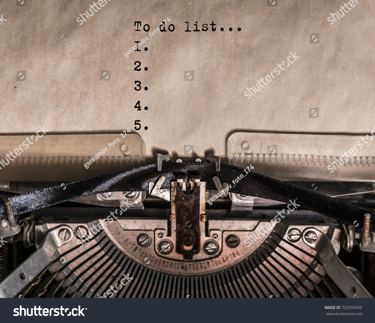 to do list words typed on a Vintage Typewriter. Mechanisms close up. Typing on old typewriter #723259369
