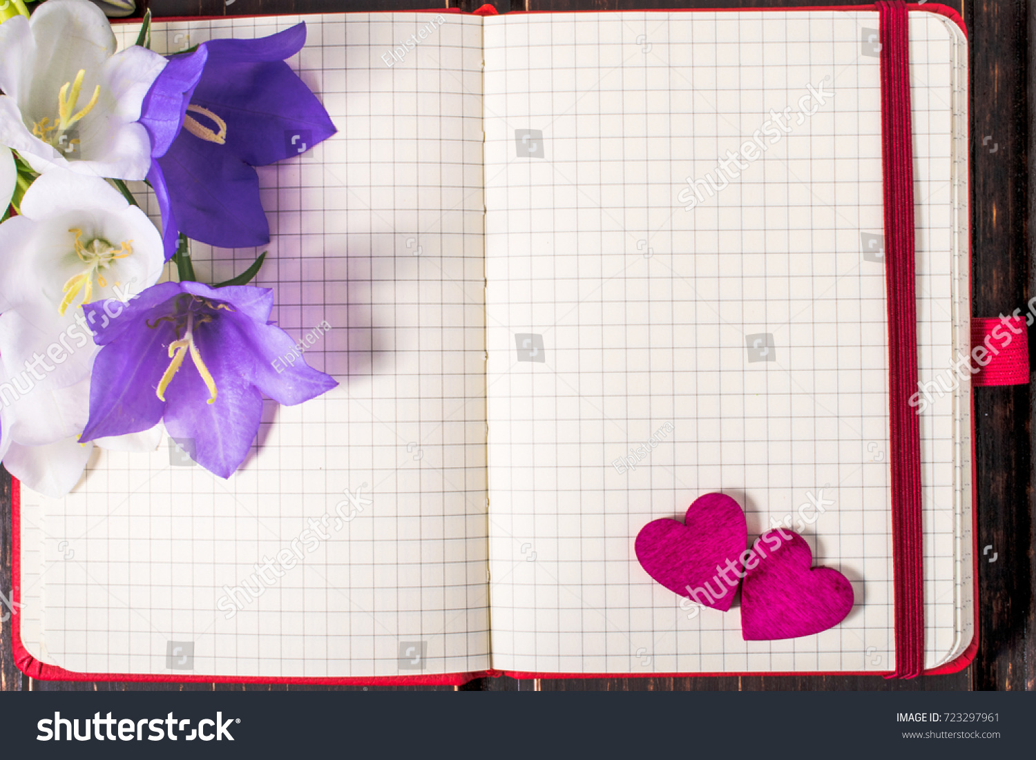 blank note book close-up with spring flowers, pink hearts and copy space on wooden background. summer border template. mock-up floral background. sale and greeting card concept. #723297961