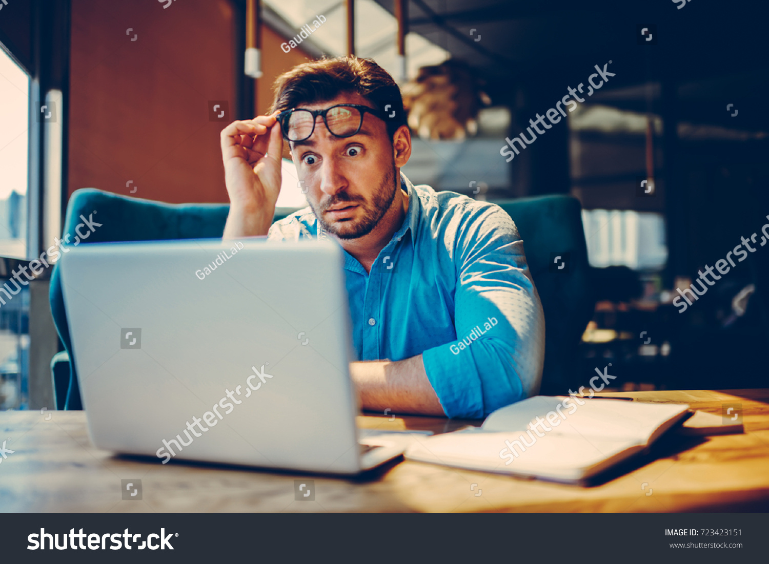 Shocked businessman getting off eyeglasses can't believe in low company income reading documents.Stressed entrepreneur doubting in receipt numbers worried about paying debt checking banking account #723423151
