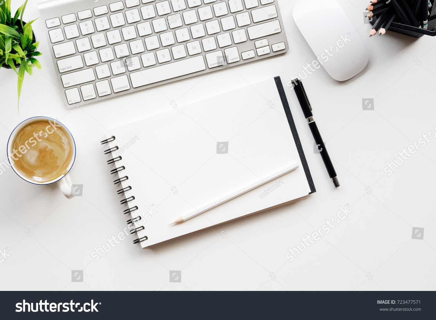 Stylish minimalistic workplace with keyboard, notebook, office plant, notebook, glasses in flat lay style. White background. Top view. #723477571