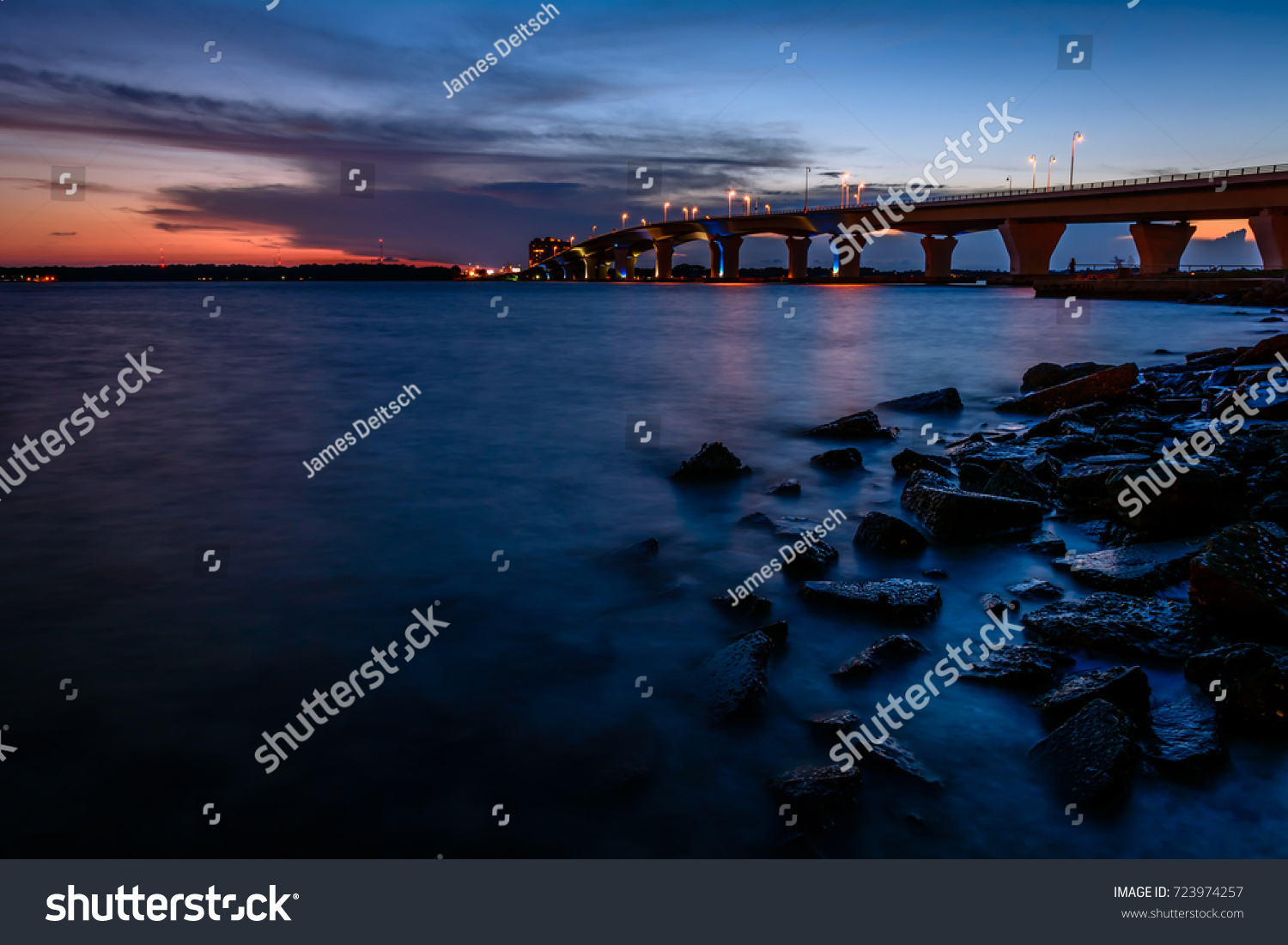 Sunset at the Hathaway Bridge connecting Panama City and Panama City Beach, Florida. #723974257