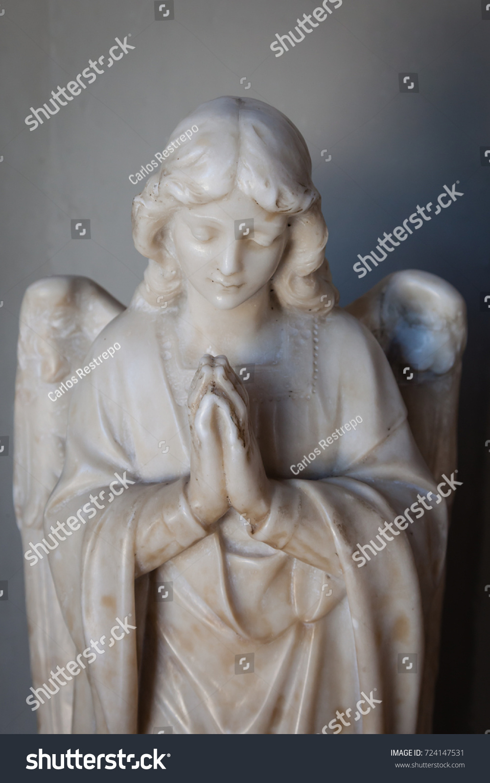 Statue of an angel at a church #724147531