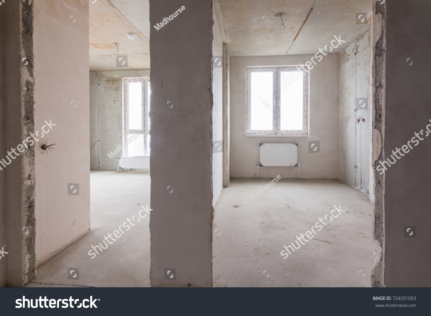 The layout of rooms and rooms in a new building, a view of two rooms and a partition between them #724331053