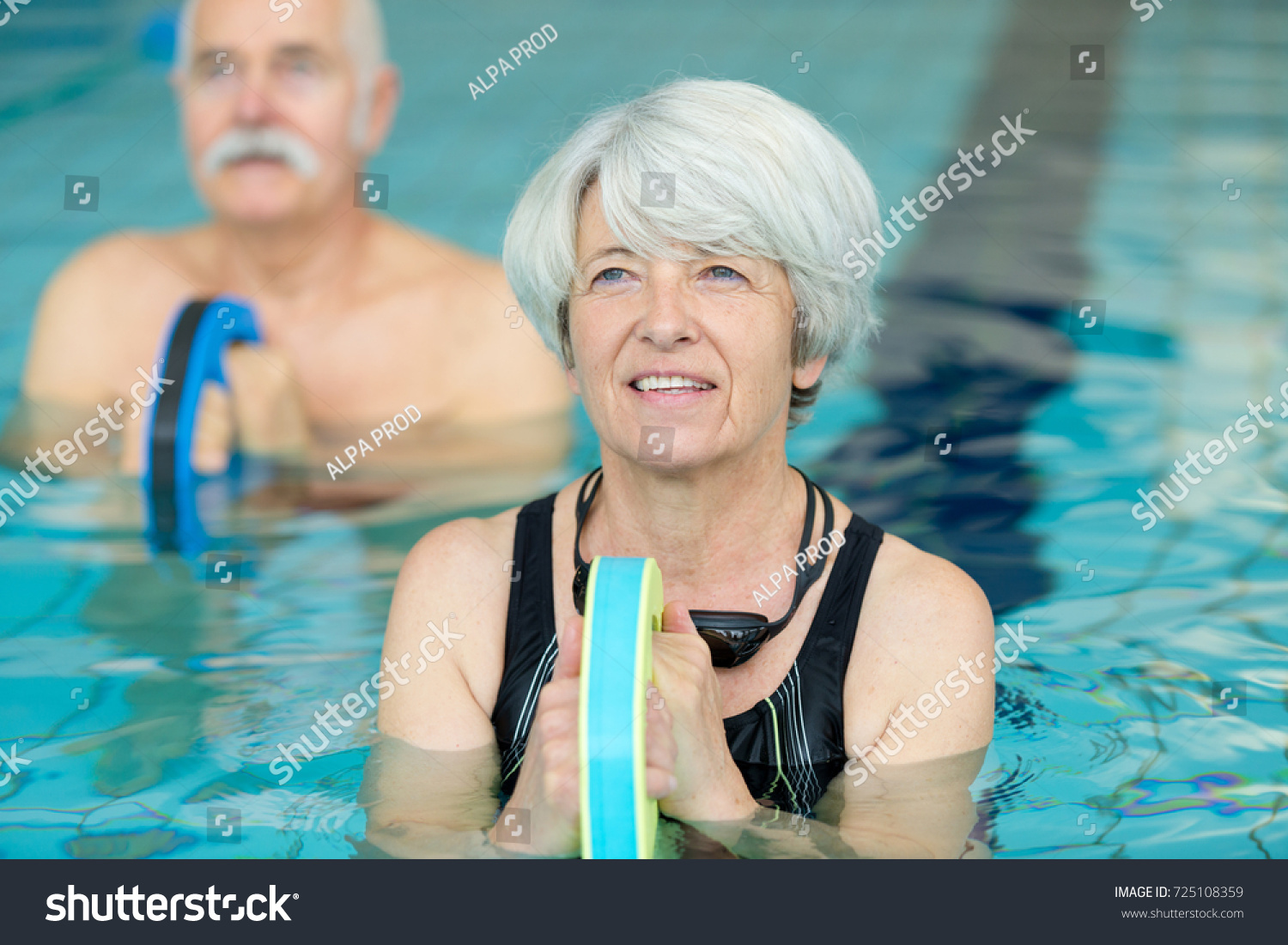 senior woman in swimming pool #725108359