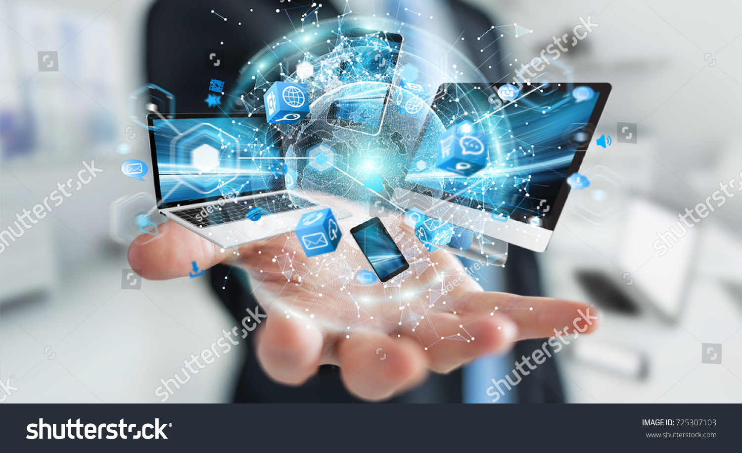 Tech devices connected to each other by businessman on blurred background 3D rendering #725307103