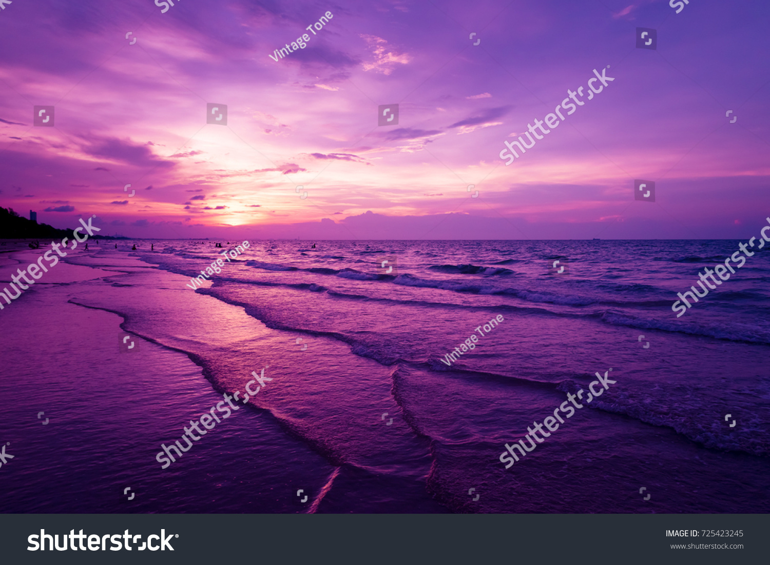 Nature in twilight period which including of sunrise over the sea and the nice beach. Summer beach with blue water and purple sky at the sunset.  #725423245