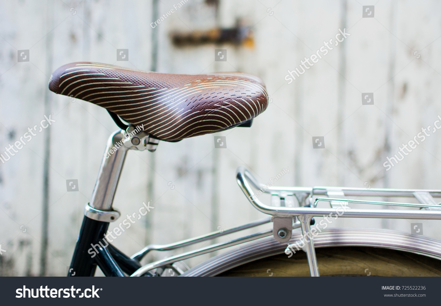 Vintage bicycle with leather seat close up #725522236