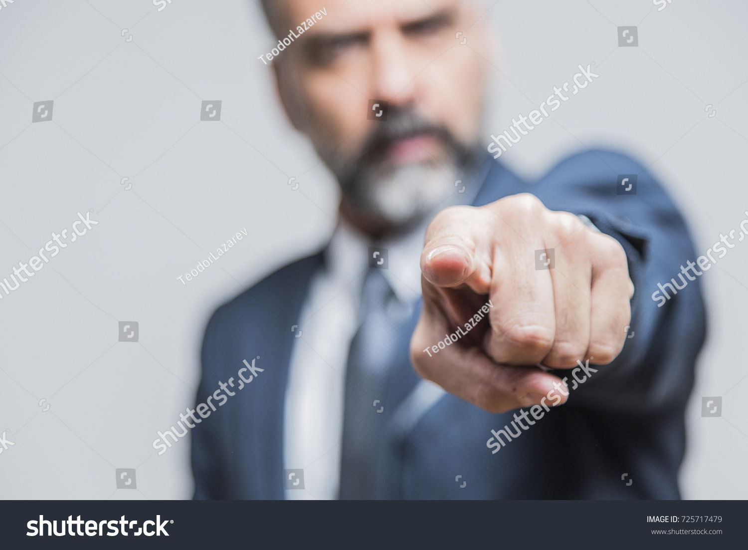 Angry senior man pointing his finger towards you, accusing and blaming #725717479