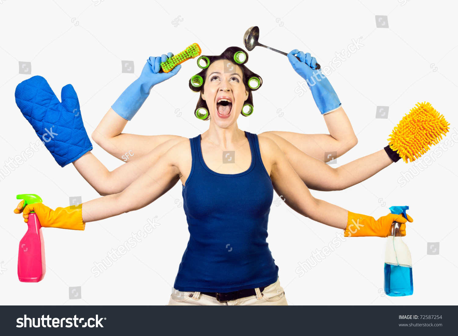 A woman in a domestic role multitasking her cleaning #72587254