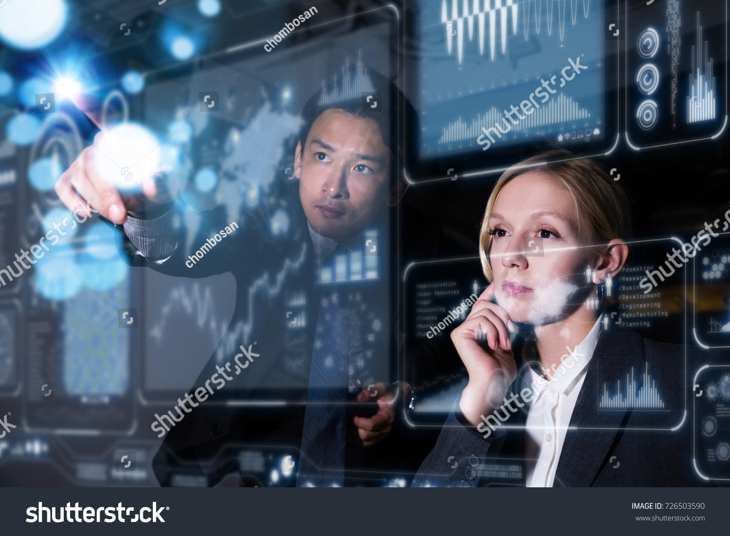 Two business persons in front of futuristic display. Graphical User Interface(GUI). Head up Display(HUD). Internet of things. #726503590