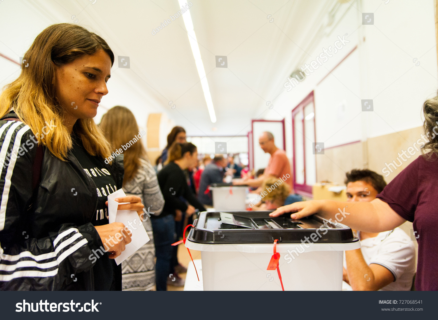 barcelona, Spain - 01 October 2017: people voting during illegal referendum for catalan indepedence #727068541
