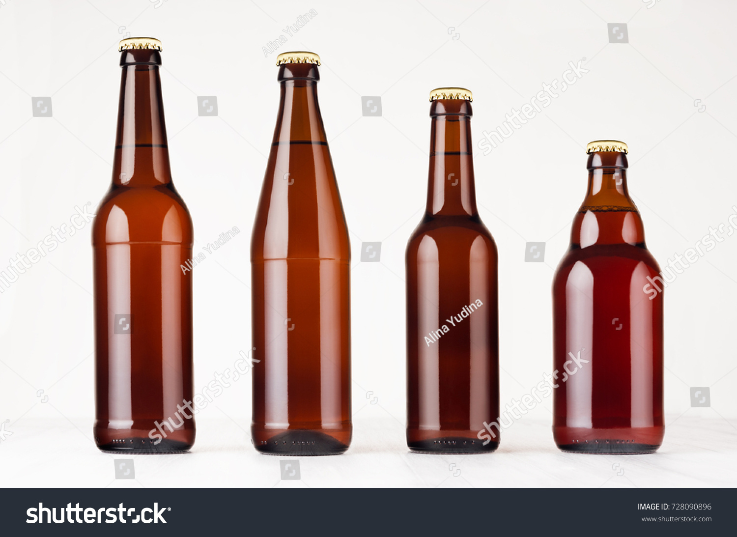 Collection different brown beer bottles, mockup. Template for advertising, design, branding identity on white wood table. #728090896
