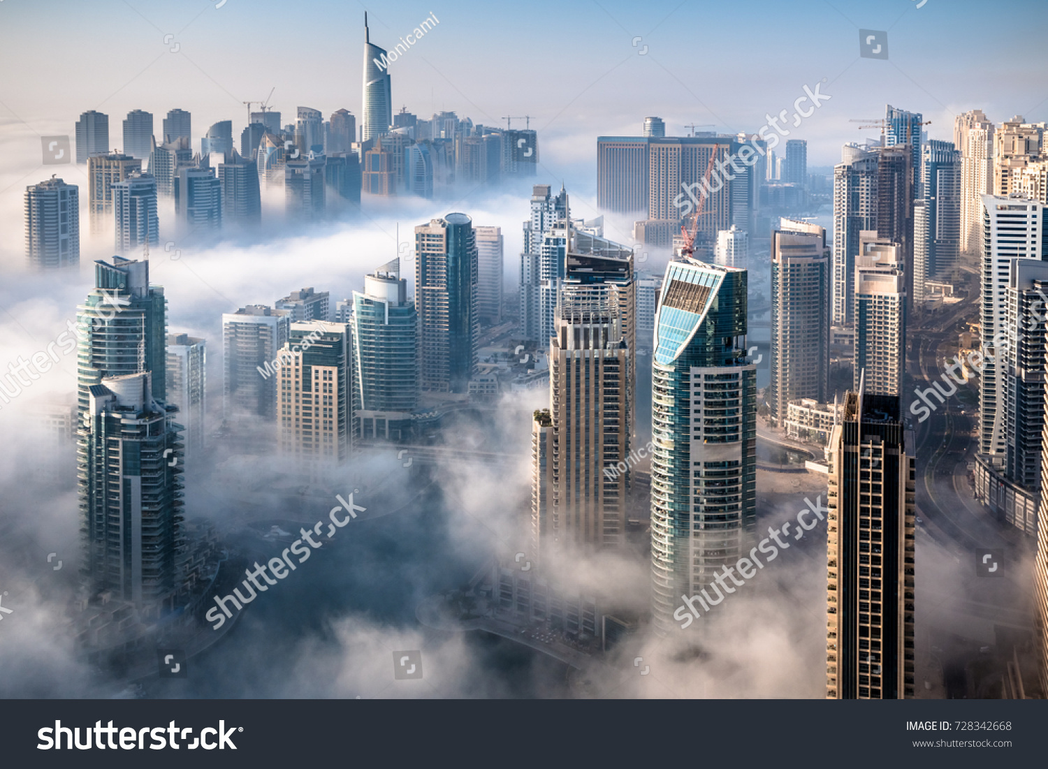Dubai skyline, an impressive aerial top view of the city in Dubai Marina on a foggy day #728342668