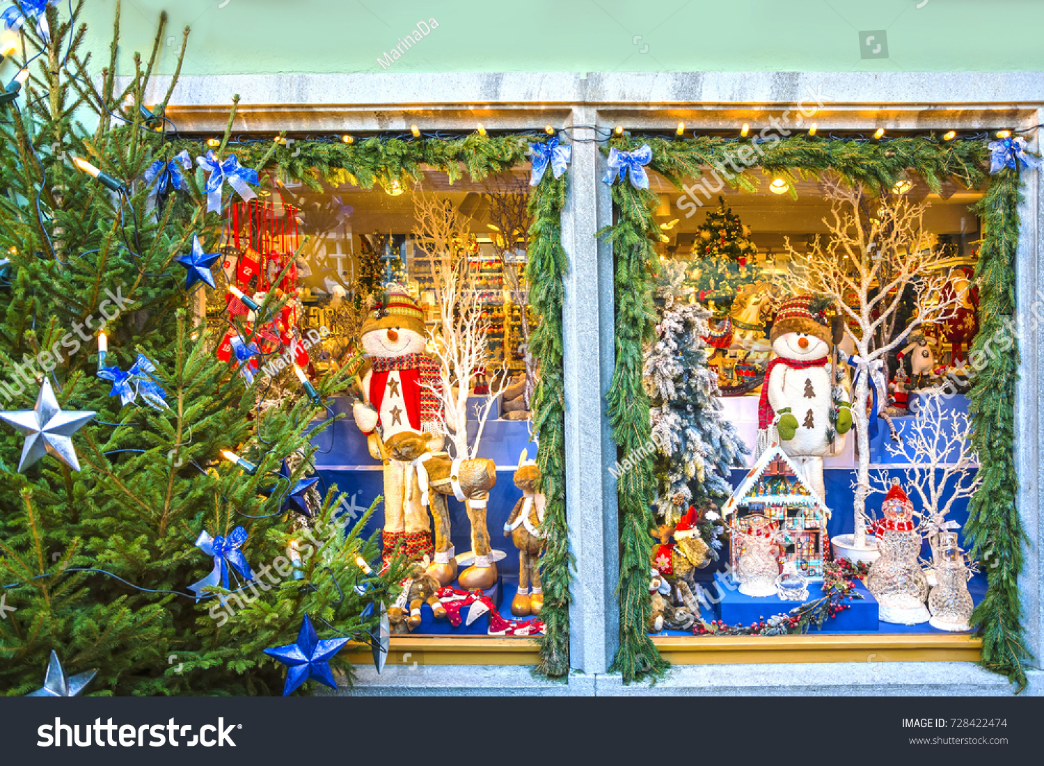 ROTHENBURG OB DER TAUBER, GERMANY - December 13, 2016:
Showcase decorated for Christmas holiday with traditional Christmas gifts in street of old fairytale town of Rothenburg ob der Tauber, Bavaria. #728422474