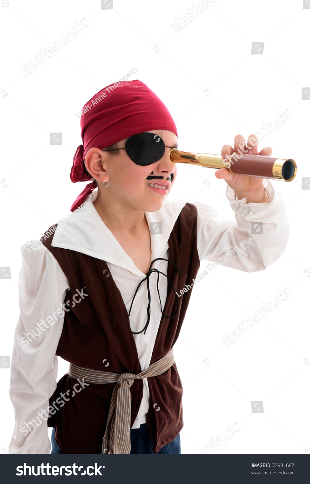 A young boy pirate looking through a monoscope in search of treasure or ships to plunder.  White background. #72931687
