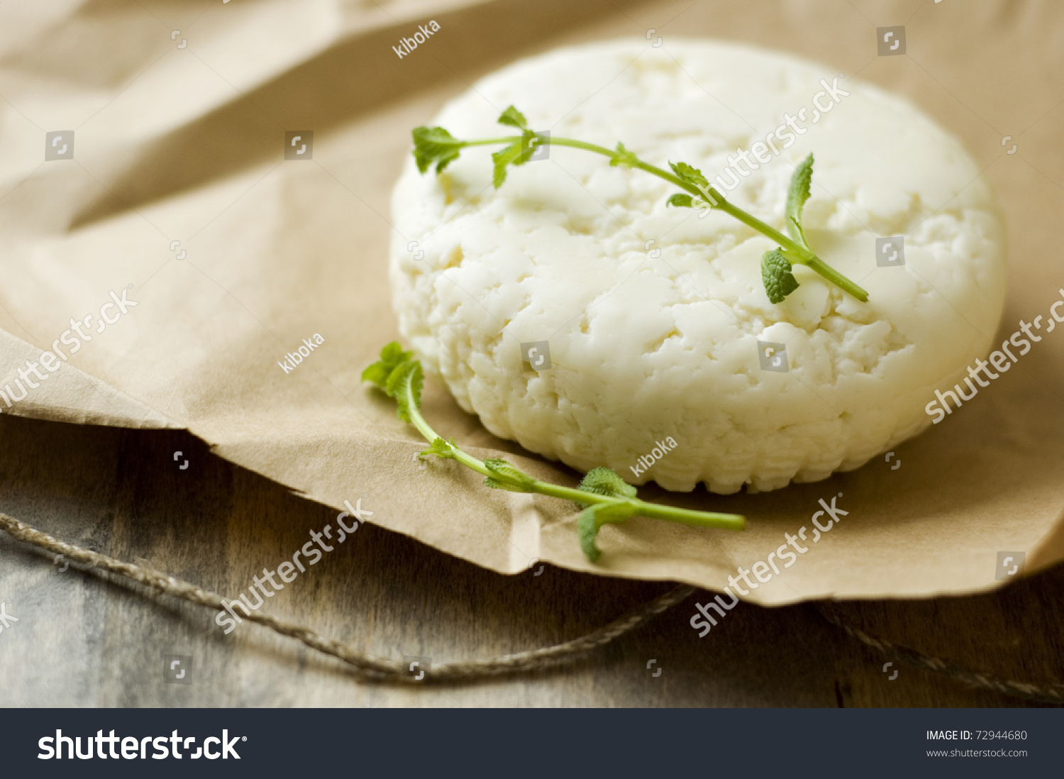 fresh feta cheese on wooden board #72944680
