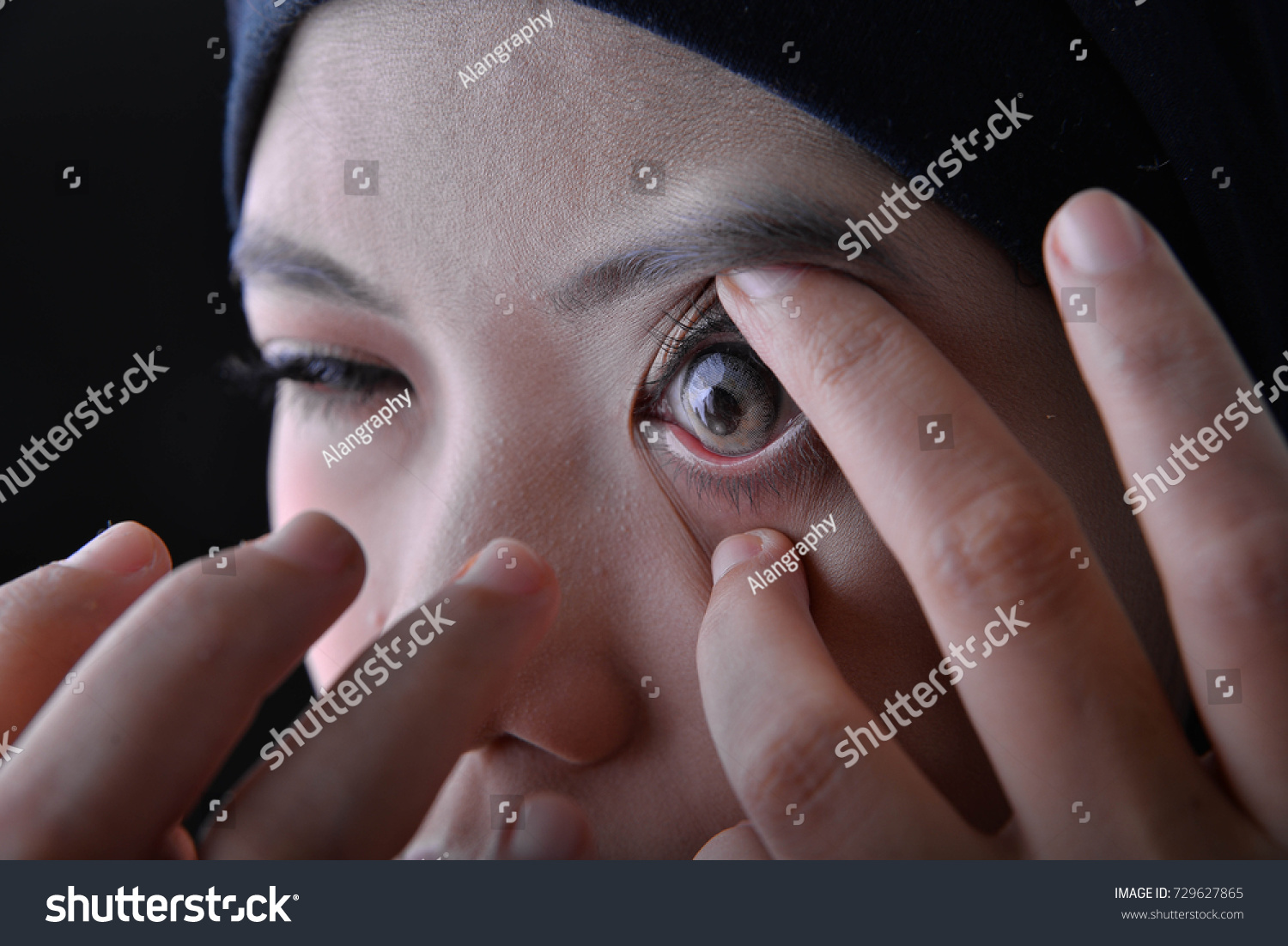 Woman use and show his contact lens design #729627865