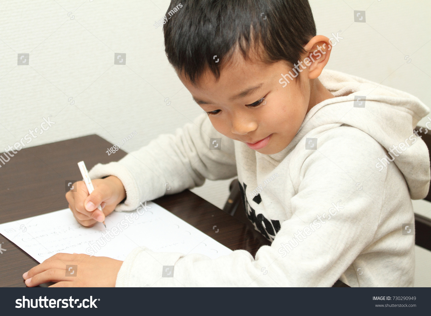 Japanese boy doing homework (first grade at elementary school) #730290949