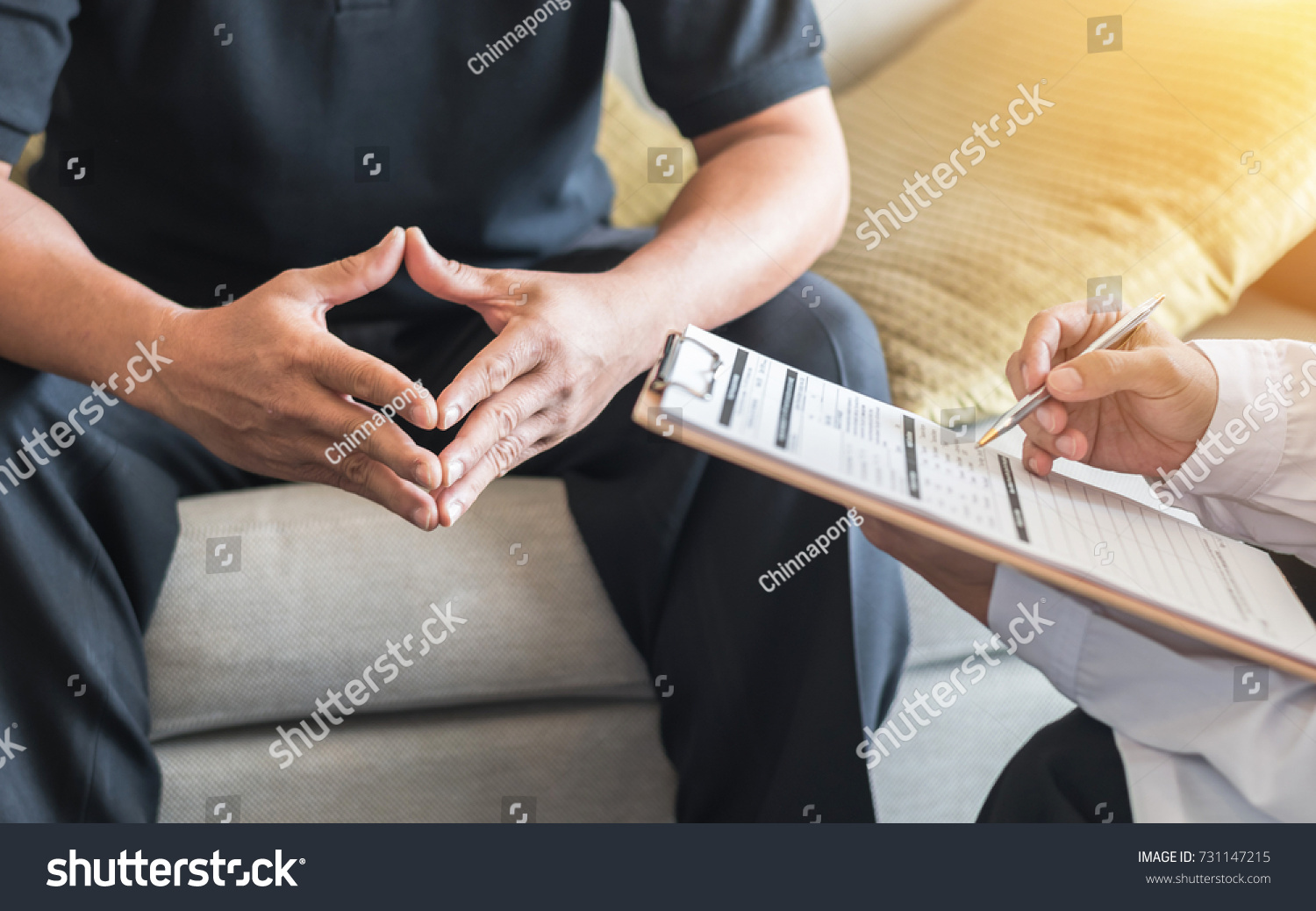 Male patient having consultation with doctor or psychiatrist who working on diagnostic examination on men's health disease or mental illness in medical clinic or hospital mental health service center