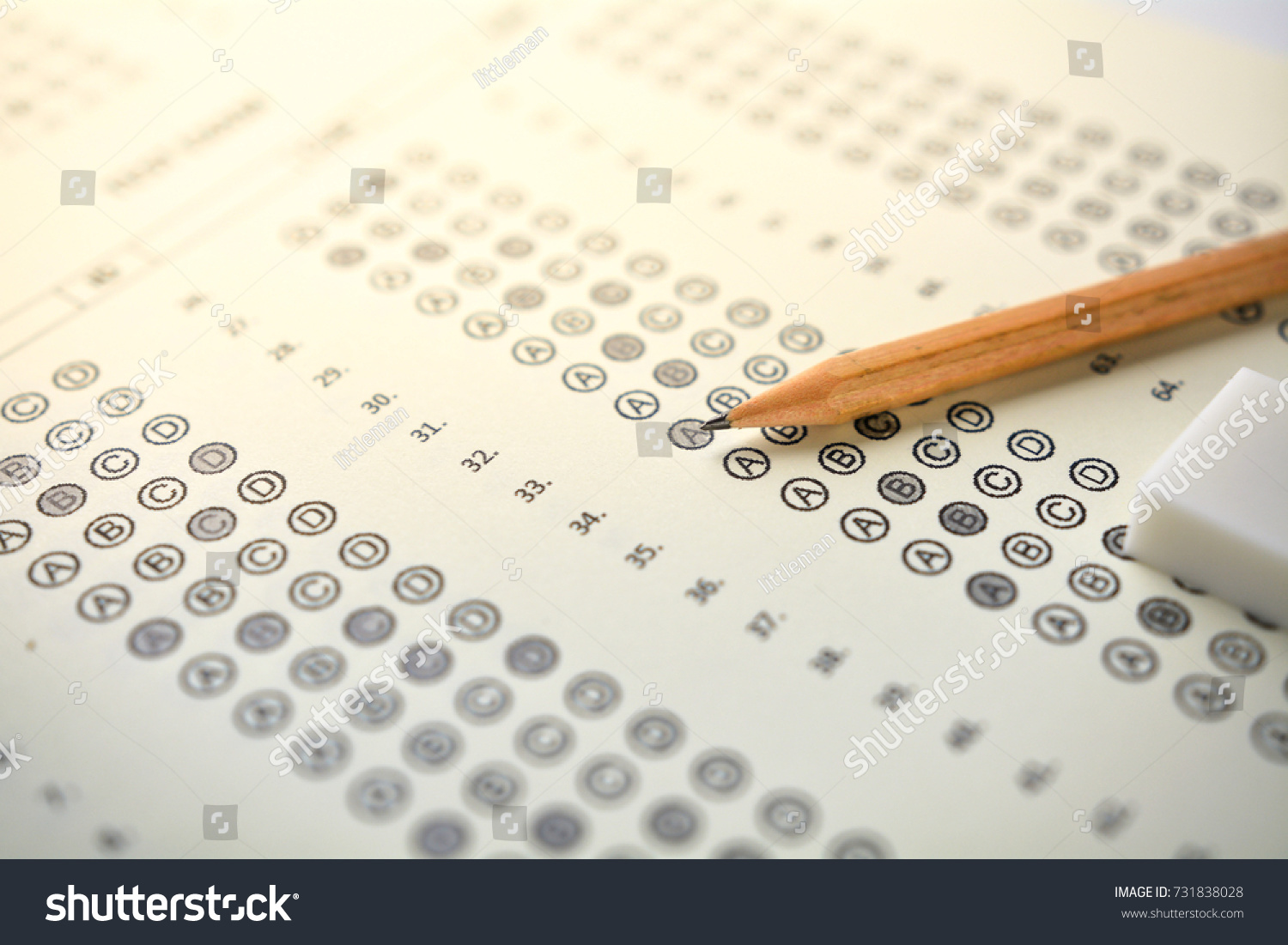 The concept of this image is a device for taking the test by writing the correct answer in the correct answer paper. #731838028