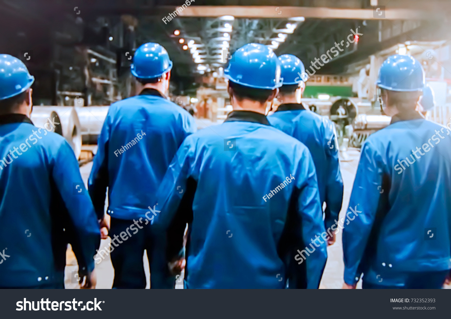 Abstract, blurry, bokeh background, image for the background. People in overalls in production #732352393