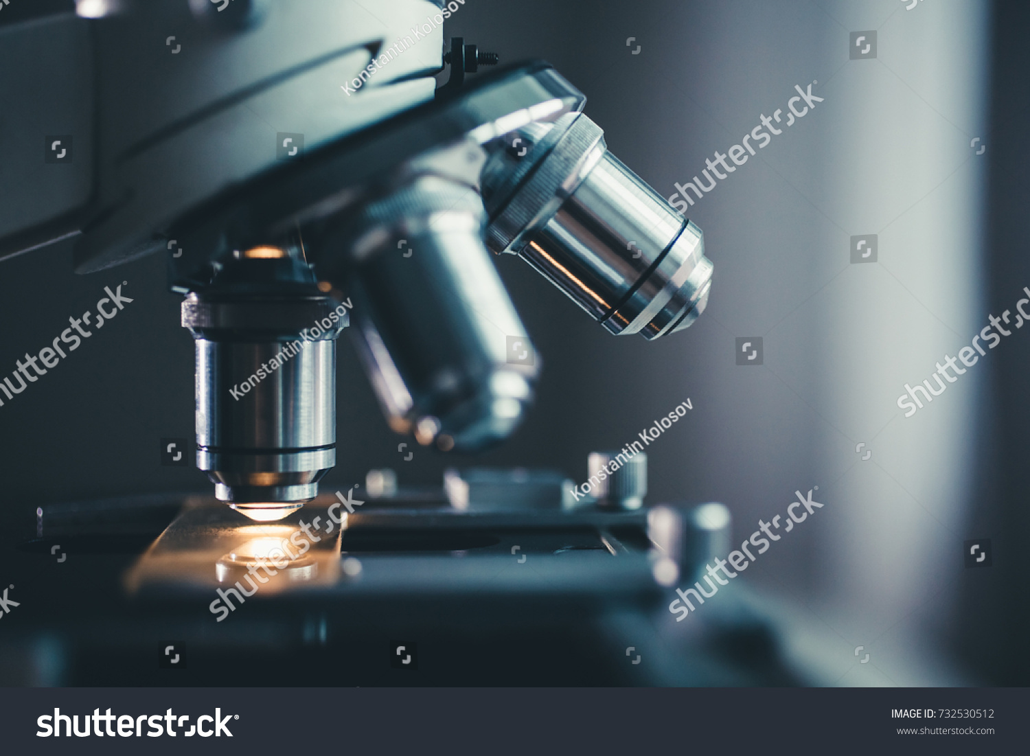 Close-up shot of microscope with metal lens at laboratory. #732530512
