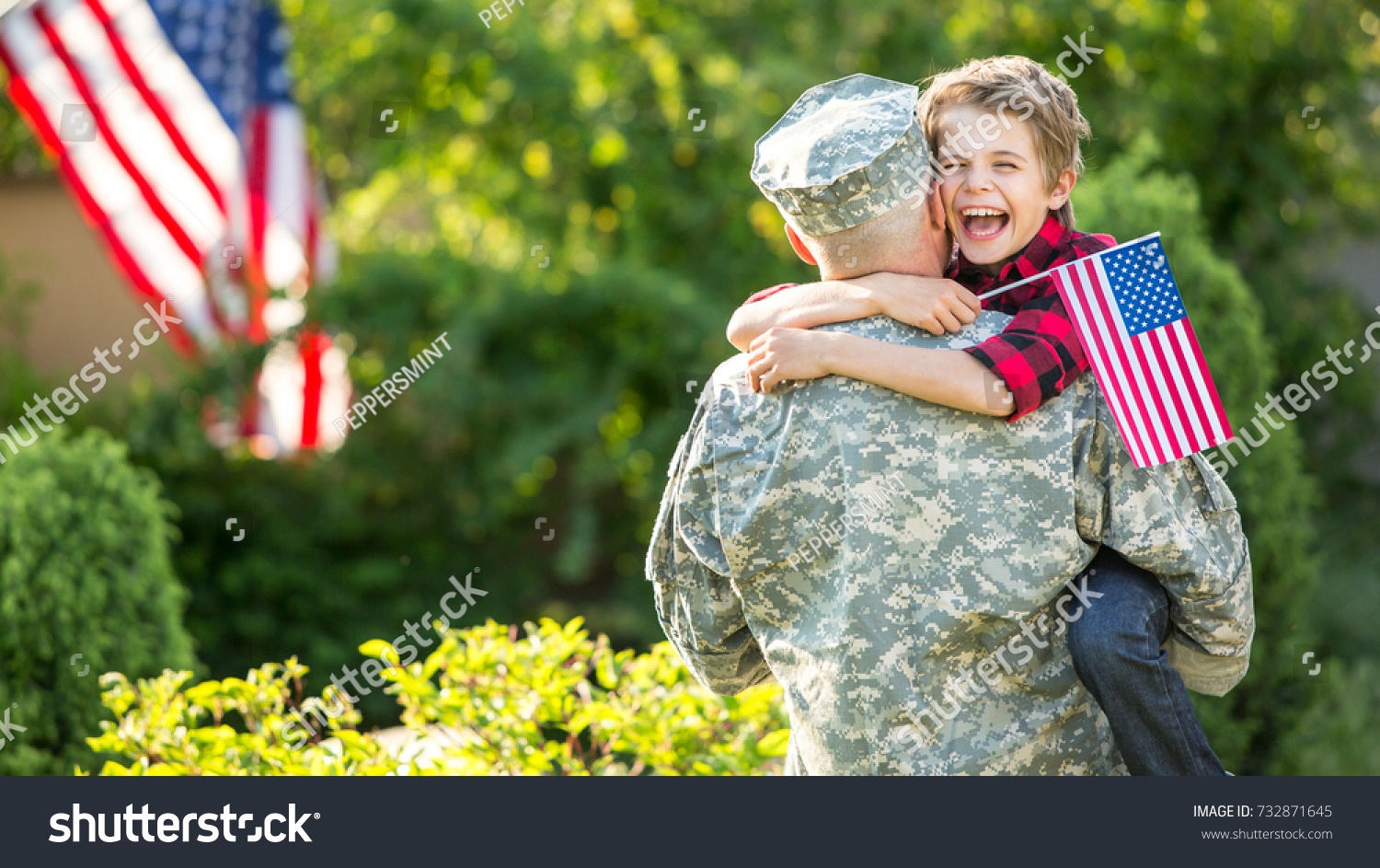 Happy reunion of soldier with family, son hug father #732871645