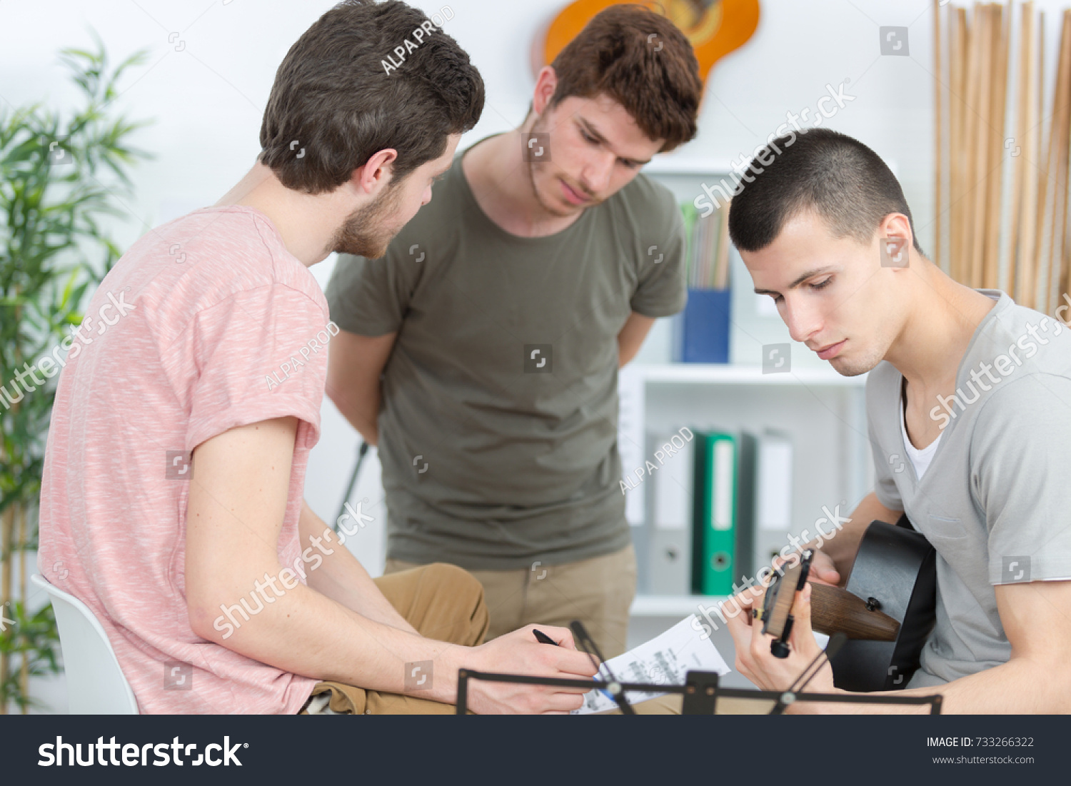 musicians with guitar at music store #733266322