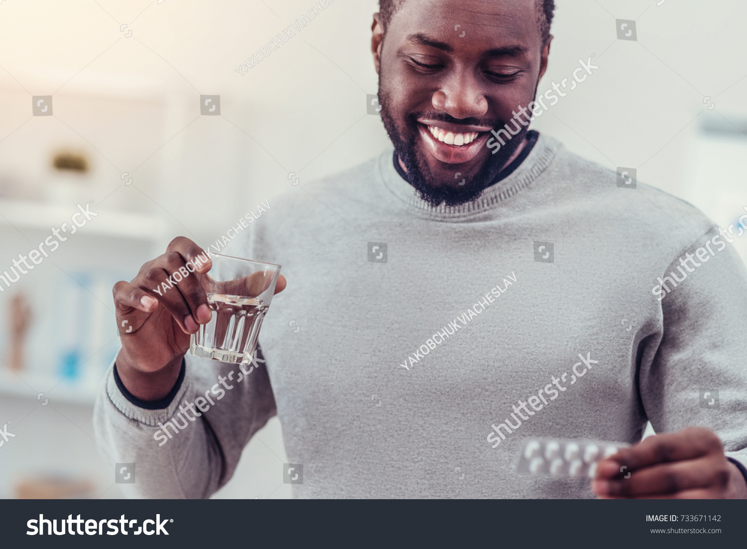 Positive minded African American man taking medication #733671142