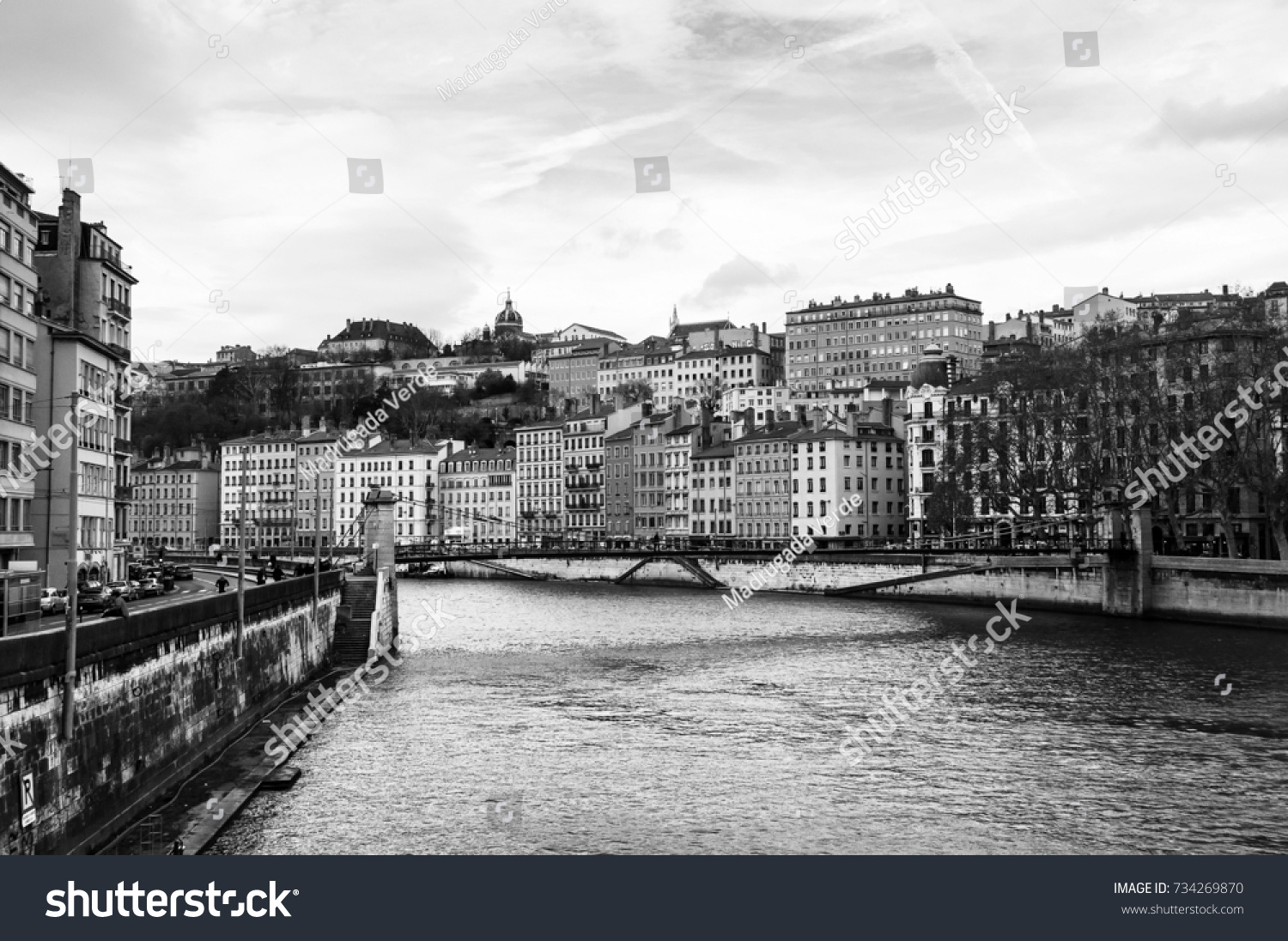 Lyon, France. Aerial view of Lyon in autumn with River and Bridge, France. Historical buildings with cloudy blue sky. Black and white #734269870