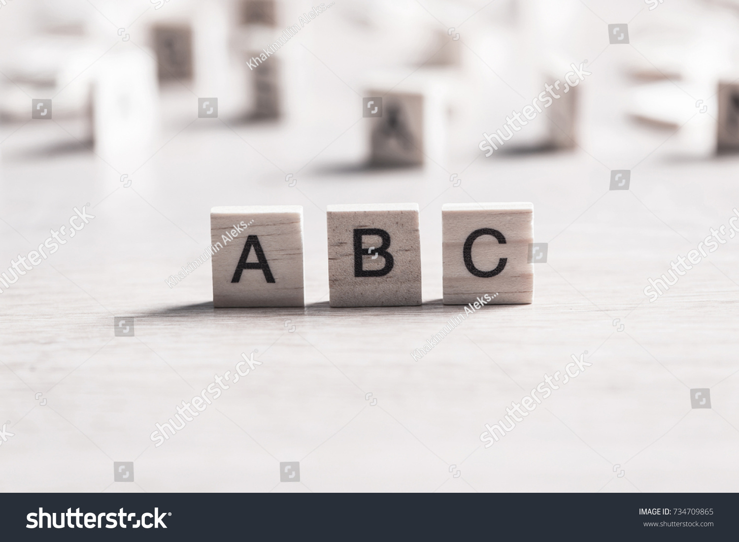 Alphabet letters on wooden pieces collected in word abc #734709865