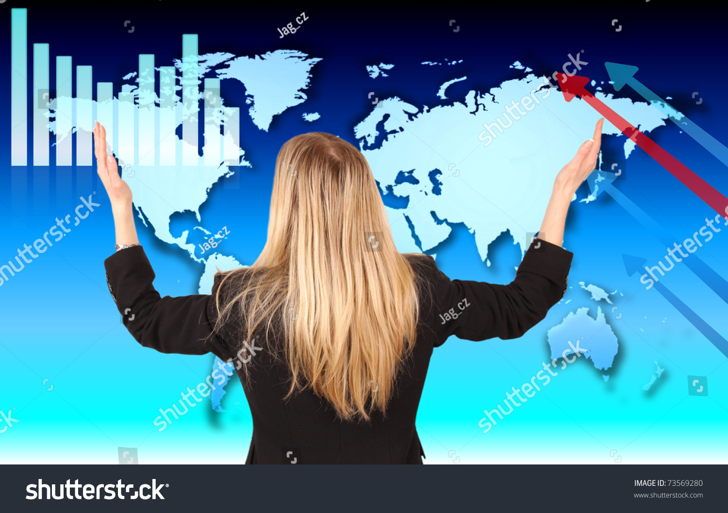 Businesswoman with hands in the air, looking at economic theme in the World #73569280