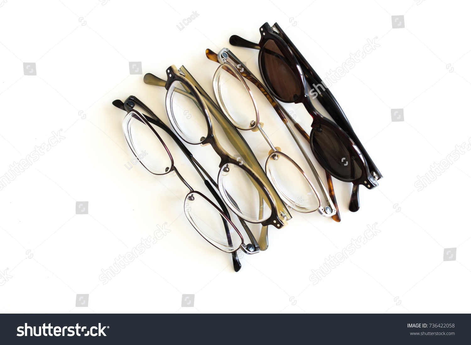 3 pairs of stylish eyeglasses and 1 pair of sunglasses in a row isolated on white #736422058