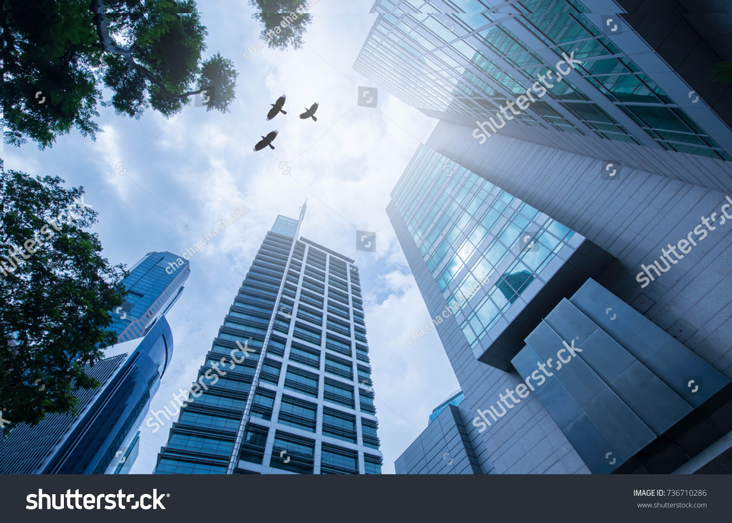 Modern office corporate building. Low angle view of skyscrapers in city of Singapore .Panoramic and perspective view Business concept of success industry tech architecture. #736710286