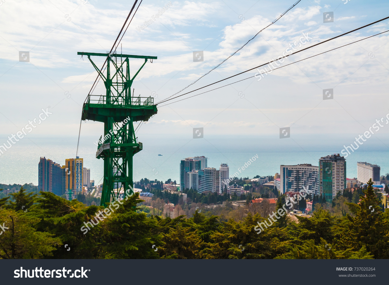 The cableway over the city on the background of the sea in sunny day, Sochi, Russia #737020264