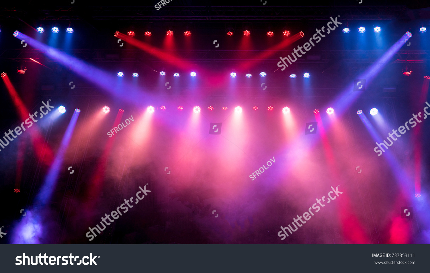 Lighting equipment on an empty stage. Red and blue. #737353111