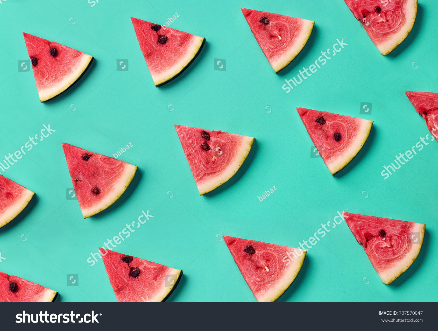 Colorful fruit pattern of fresh watermelon slices on blue background. From top view #737570047