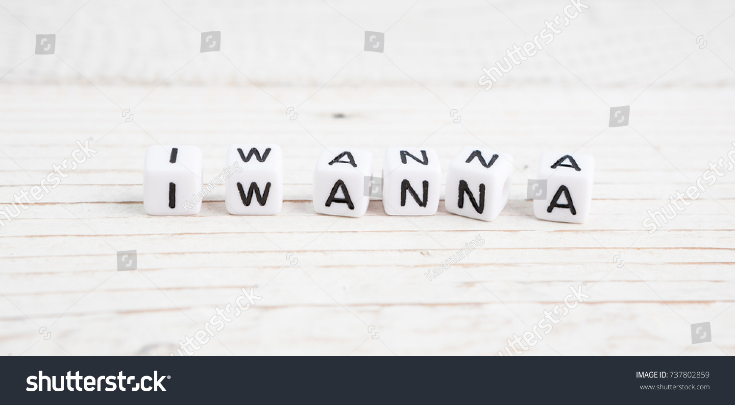 Phrase I wanna made of white plastic cubes. Long format horizontal banner. a series of conceptual phrases and words. #737802859